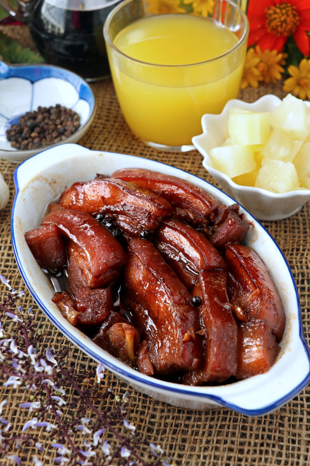 Pork Belly cooked in soy sauce, pineapple juice and spices until melt-in-your-mouth tnder.